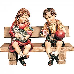 1019 - Bub und Mädchen sitzend auf Bank